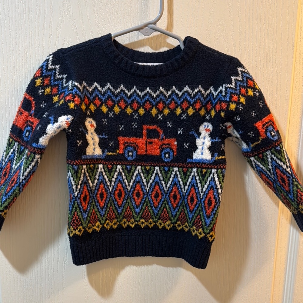 Festive Sweater with Snowman and Truck Design